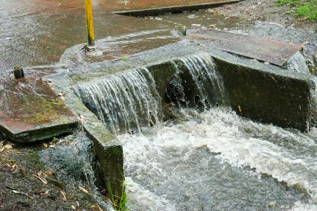 A little waterfall across a mini creek dam