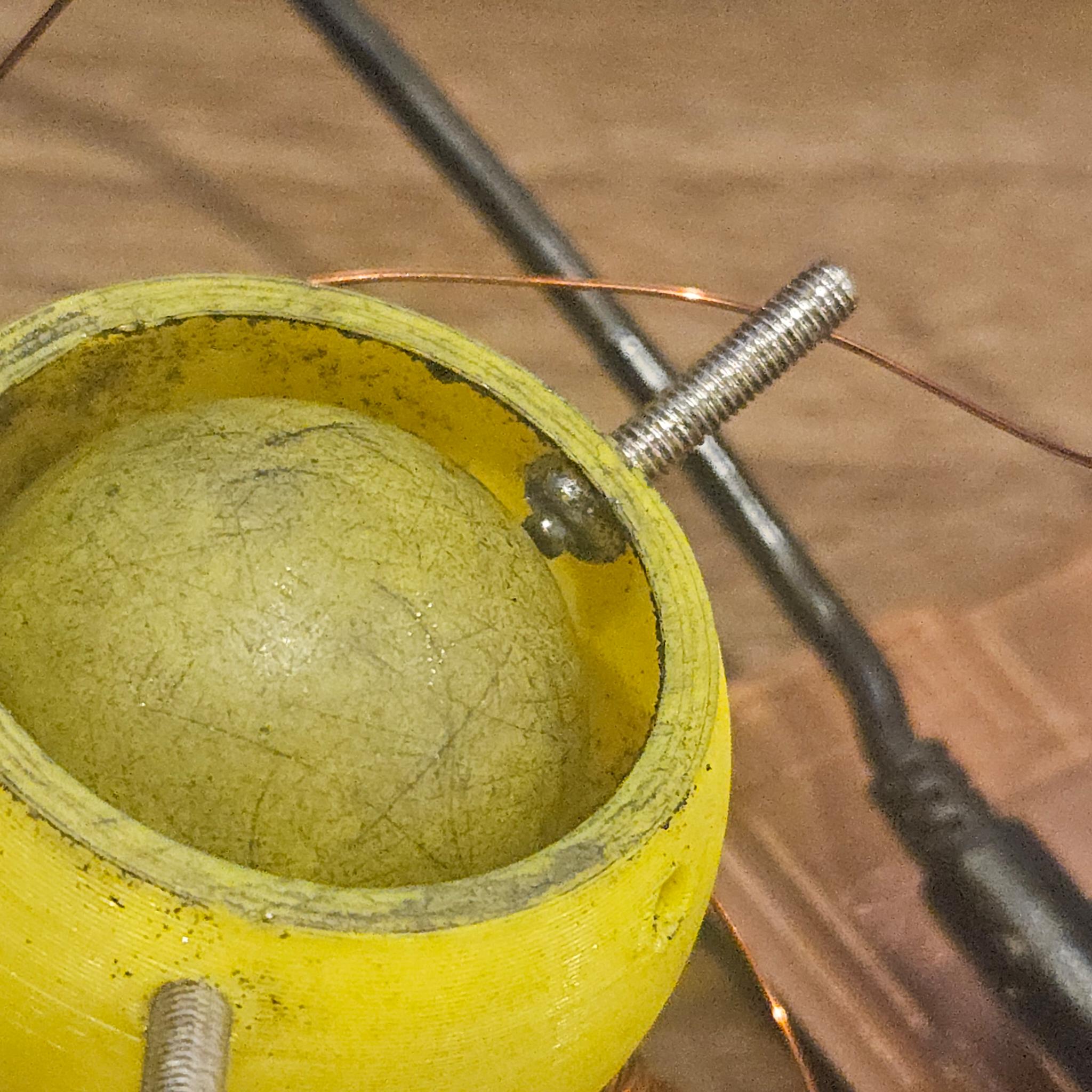 Screw with a tiny bearing ball placed on its tip